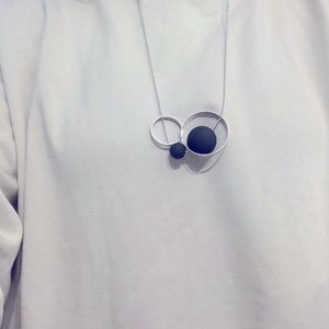 Lovely Pursuit of Happiness silver and black geo necklace.